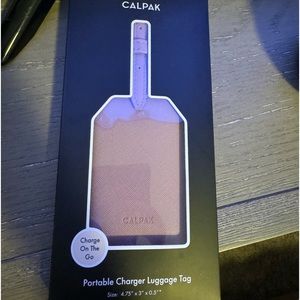 Calpak portable luggage tag charger. Brand new never opened.